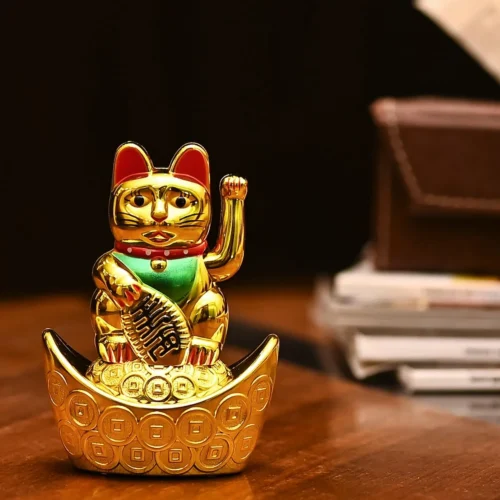 Feng Shui Lucky Cat Figurine Sitting on Gold Ingots – Symbol of Wealth, Prosperity, and Good Luck