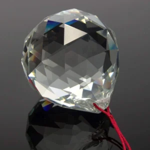 Feng Shui crystal sun catcher reflecting rainbow light indoors