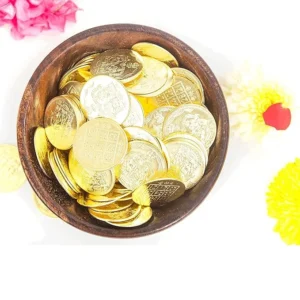 A set of 27 gold-plated Lakshmi Kubera Coins arranged neatly, used for Vastu remedies, Lakshmi puja, and wealth attraction, engraved with divine symbols of Goddess Lakshmi and Lord Kubera.